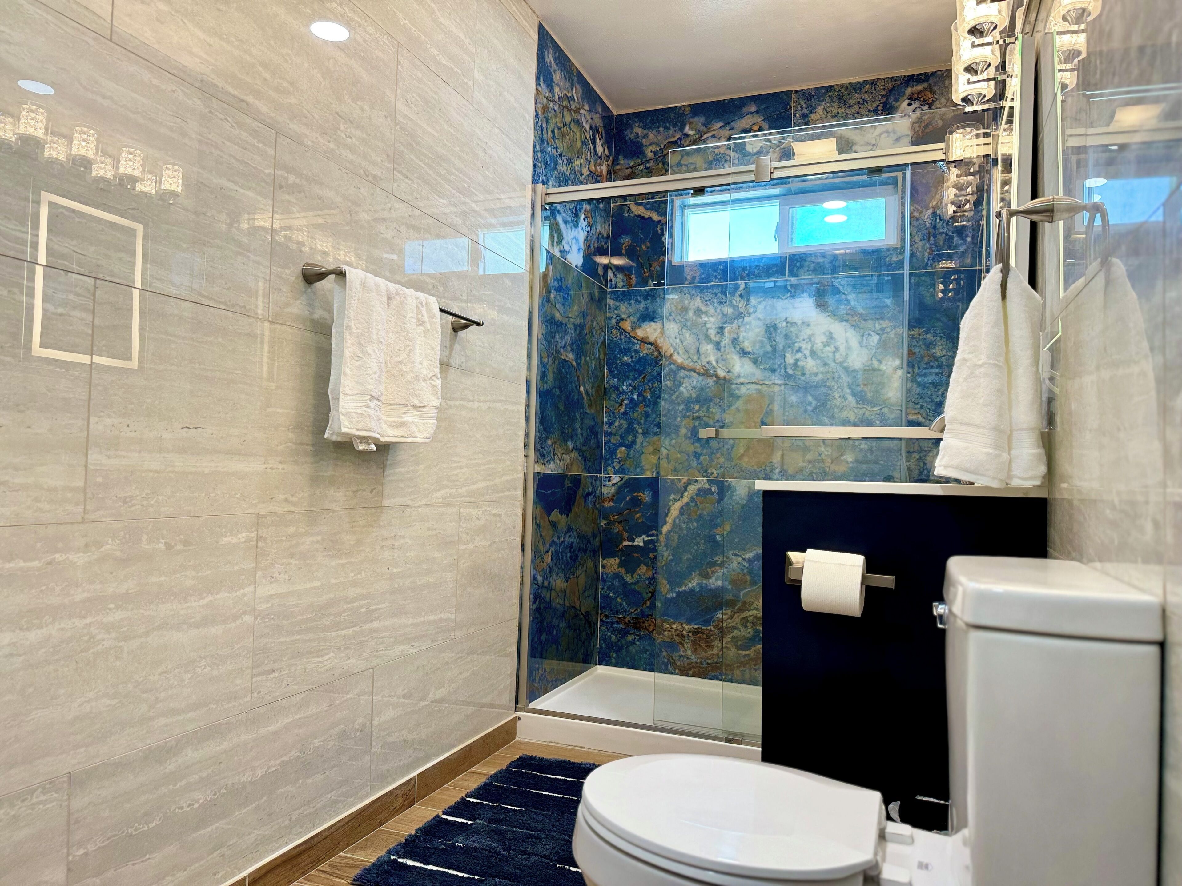 Shower, hair dryer, towels, soap