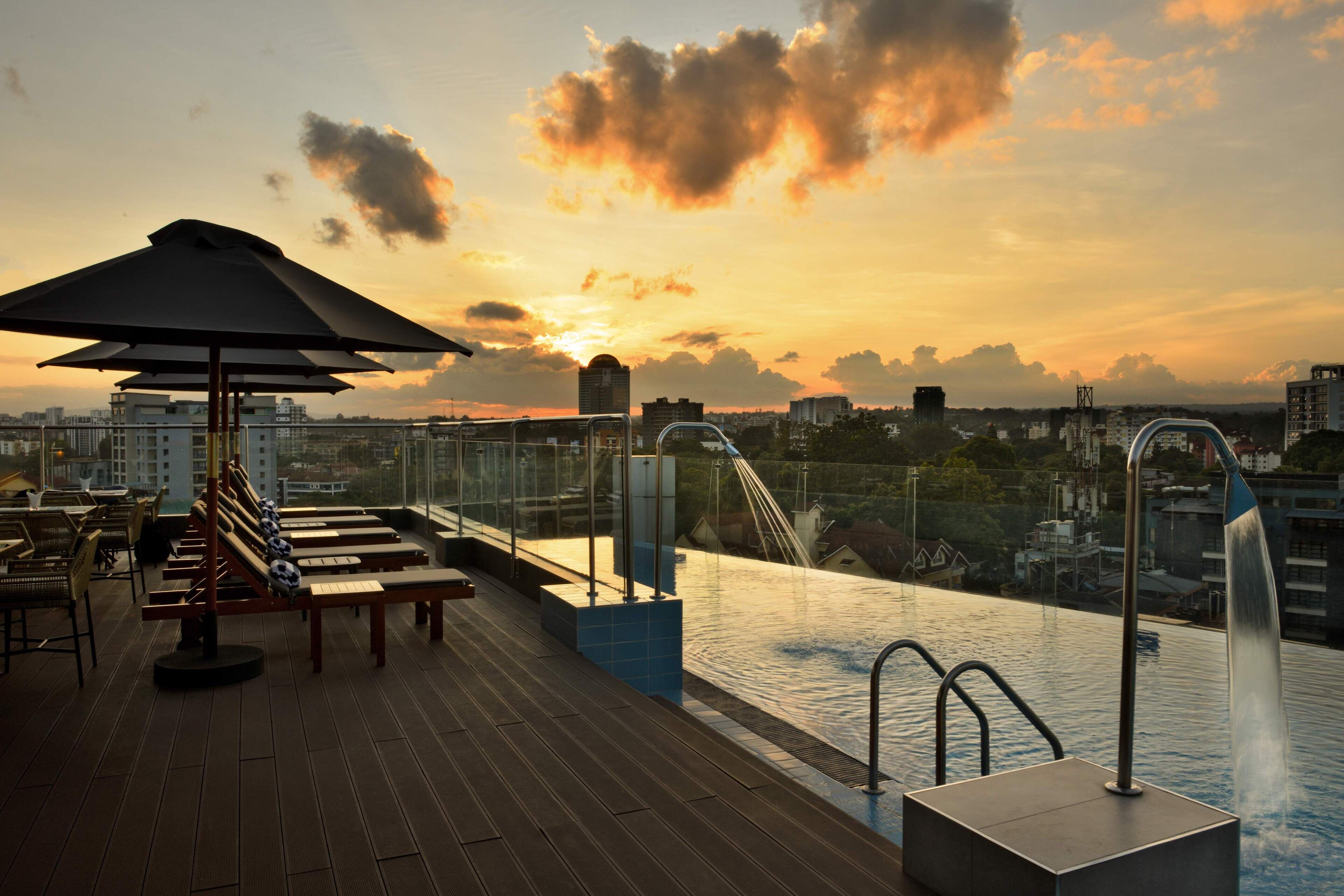 Outdoor pool, open 6:00 AM to 7:00 PM, pool umbrellas, sun loungers