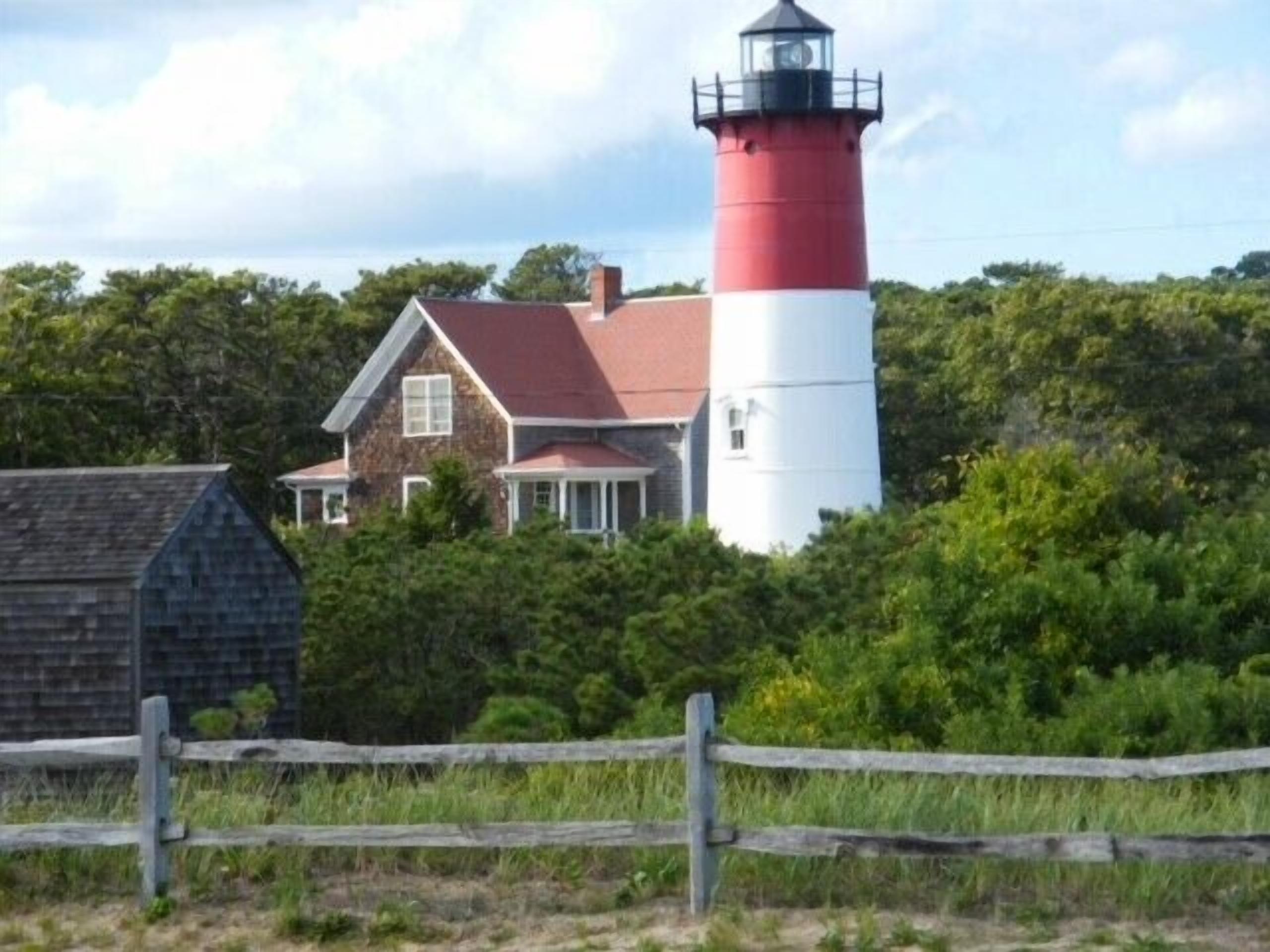 Spend your vacation in a historic lighthouse keeper's cottage, overlooking Nauset Light Beach'