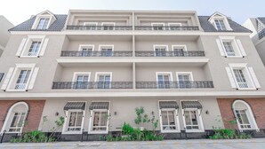 A multi-story building with balconies, large windows, and a brick facade. - Mabaat - Al Narjis - 549 (Riyadh)