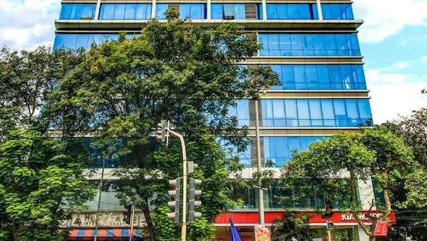 A multi-story building with large glass windows and a modern architectural design. - New Axis By Glitz Hotels (Mumbai)