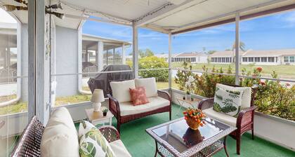 Waterfront getaway with AC, W/D pool, and tennis access