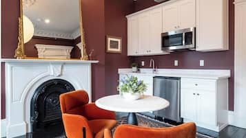 Fridge, microwave, coffee/tea maker, cookware/dishes/utensils