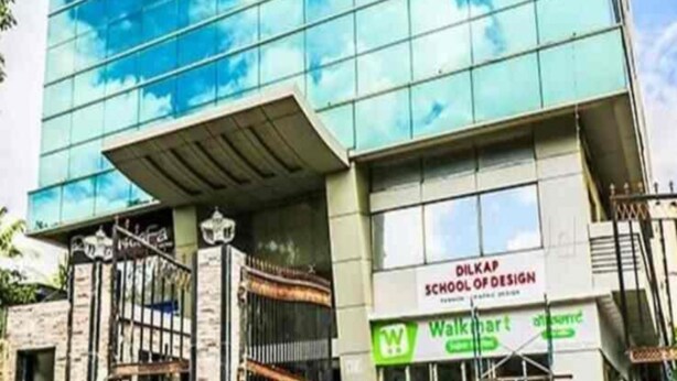 A modern building with a glass facade reflecting the sky, labeled as 'DILKAP SCHOOL OF DESIGN'. - Ascot By Glitz Hotels (Mumbai)