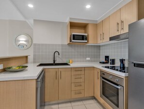 Fridge, microwave, oven, stovetop - The Pool Resort Kingscliff - 1BR with Small Pool View (5216) - Holiday Management Co. (Tweed)