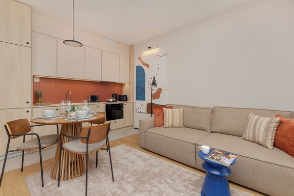 Apartment, 1 Bedroom, Balcony | Living room | 55-inch Smart TV with digital channels