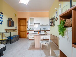 Fridge, oven, highchair, cookware/dishes/utensils