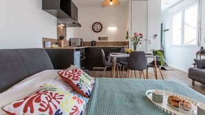 A modern apartment with a living area, kitchen, and dining space. - Cap Océan by Interhome (Capbreton)