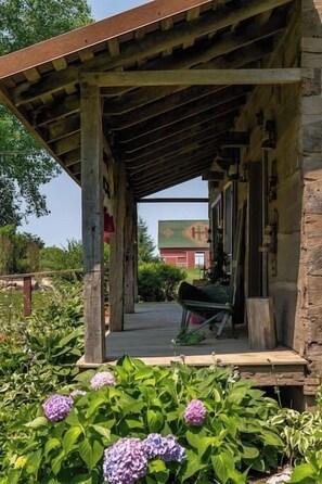 Exterior detail - Vintage 1850's Log Cabin Glamping (Flora)