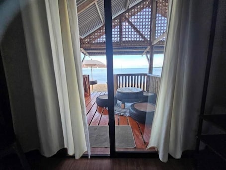 Family Triple Room. Tambayan Rooms & Cottages by SMS Hospitality