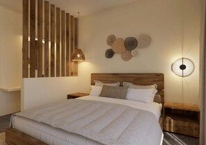 Relax in this serene bedroom with a large bed, wooden headboard, and nightstands.