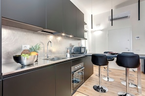 Apartment | Private kitchen | Full-size fridge, microwave, oven, stovetop