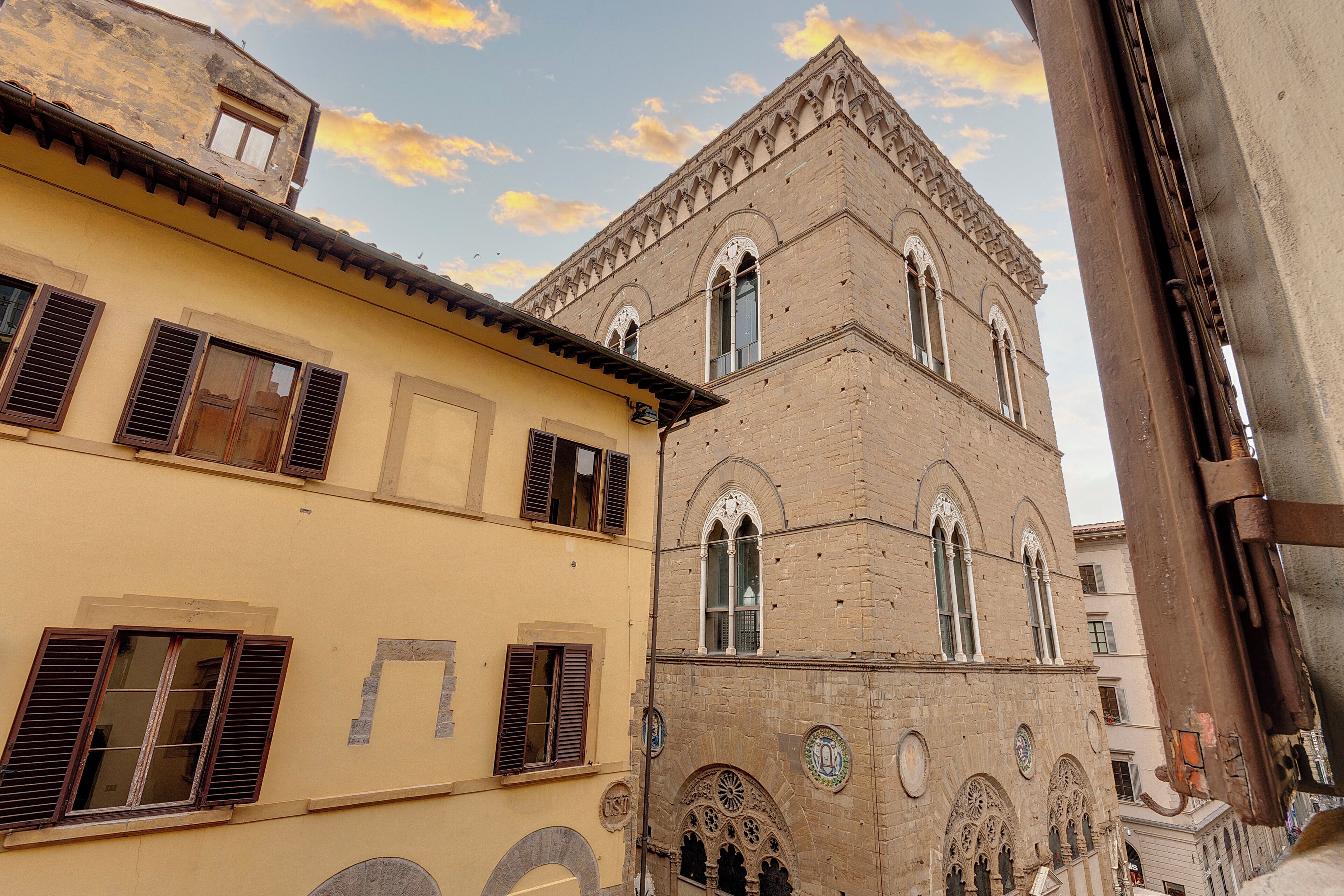 A building with arched windows and a clock tower.