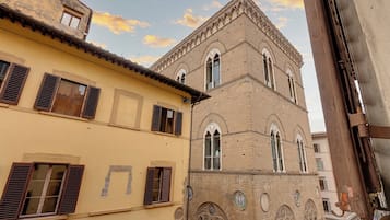 A building with arched windows and a clock tower.