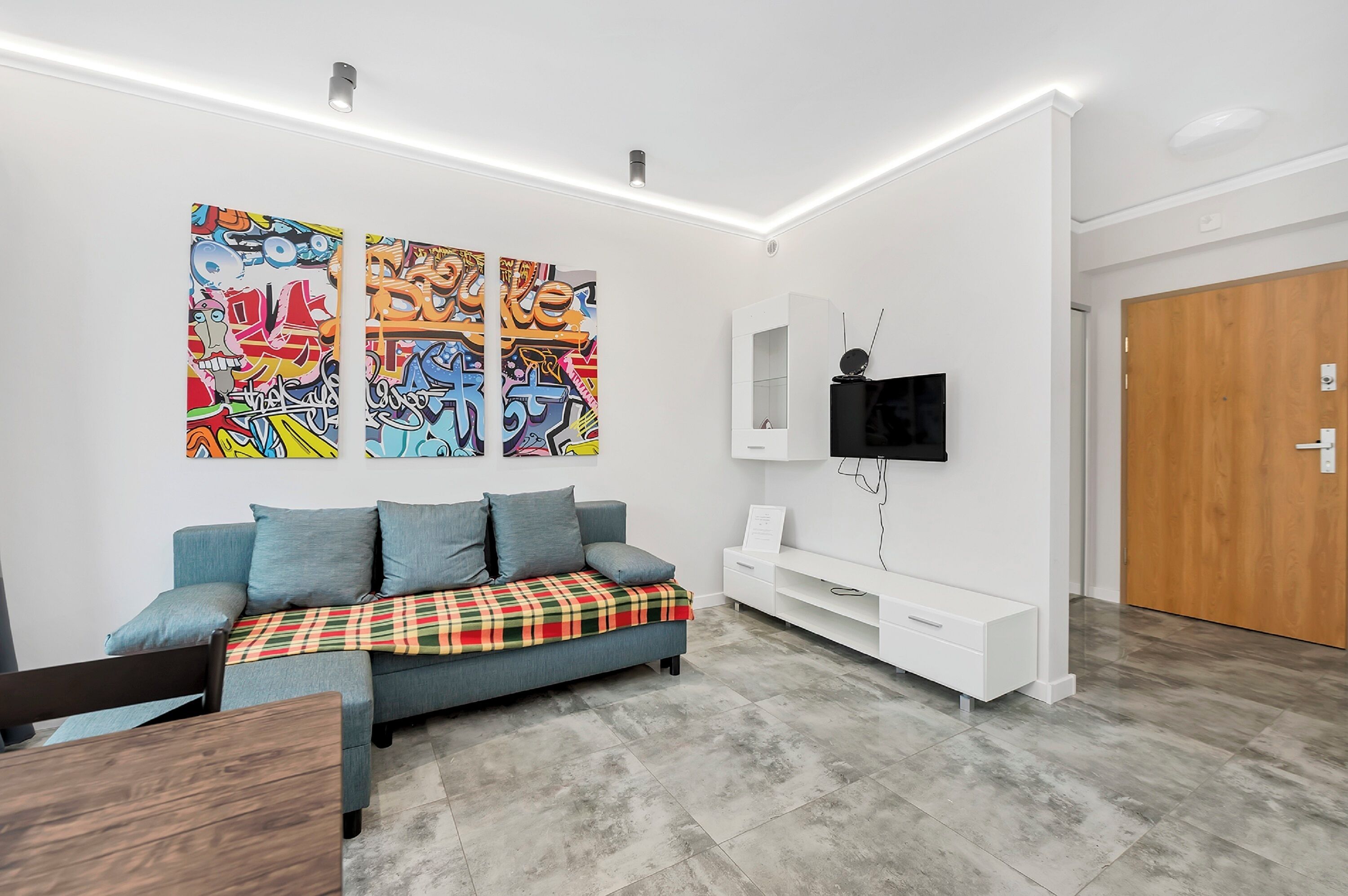 Basic Apartment | Living area | 20-inch TV with cable channels