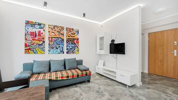 Basic Apartment | Living area | 20-inch TV with cable channels