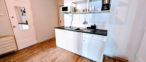 Fridge, microwave, stovetop, coffee/tea maker