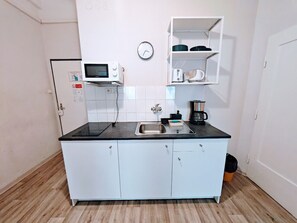 Fridge, microwave, stovetop, coffee/tea maker
