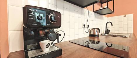 Fridge, microwave, stovetop, coffee/tea maker