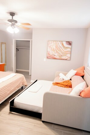 1 bedroom, desk, iron/ironing board, travel crib