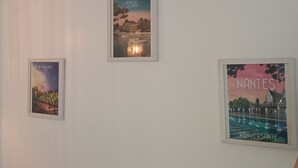 Three framed posters on a wall.