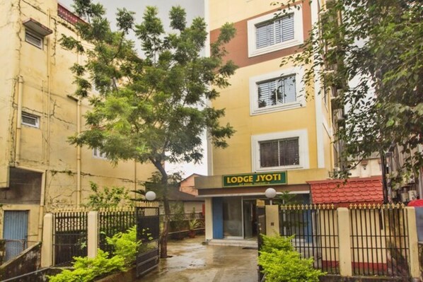 A building with a sign reading "Lodge Jyoti."