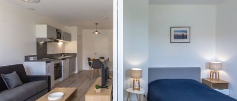 Un apartamento moderno con sala de estar, cocina y dormitorio.