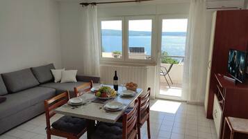 Standard Apartment, Multiple Bedrooms (Sea View Apartment Neti) | Living area | 21-inch flat-screen TV with digital channels, TV