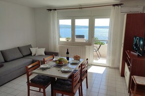 Standard Apartment, Multiple Bedrooms (Sea View Apartment Neti) | Living area | 21-inch flat-screen TV with digital channels, TV