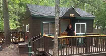 A Stream runs through it. Comfy little cabin with a stream by your bedroom.