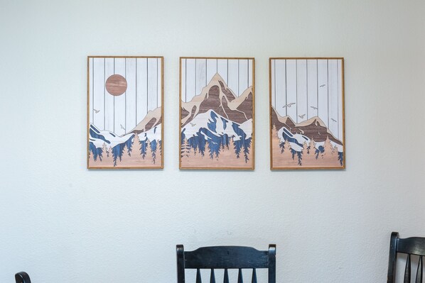 Three framed artworks depicting mountain landscapes on a white wall. - FAIR27 | Golf Course Views + Private Hot Tub + Bikes | Sleeps 8 (Sunriver)