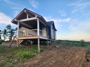 Exterior - Small cottage house, centered on 100 acres surround by hills, lake, and cattle.  (Brooks)