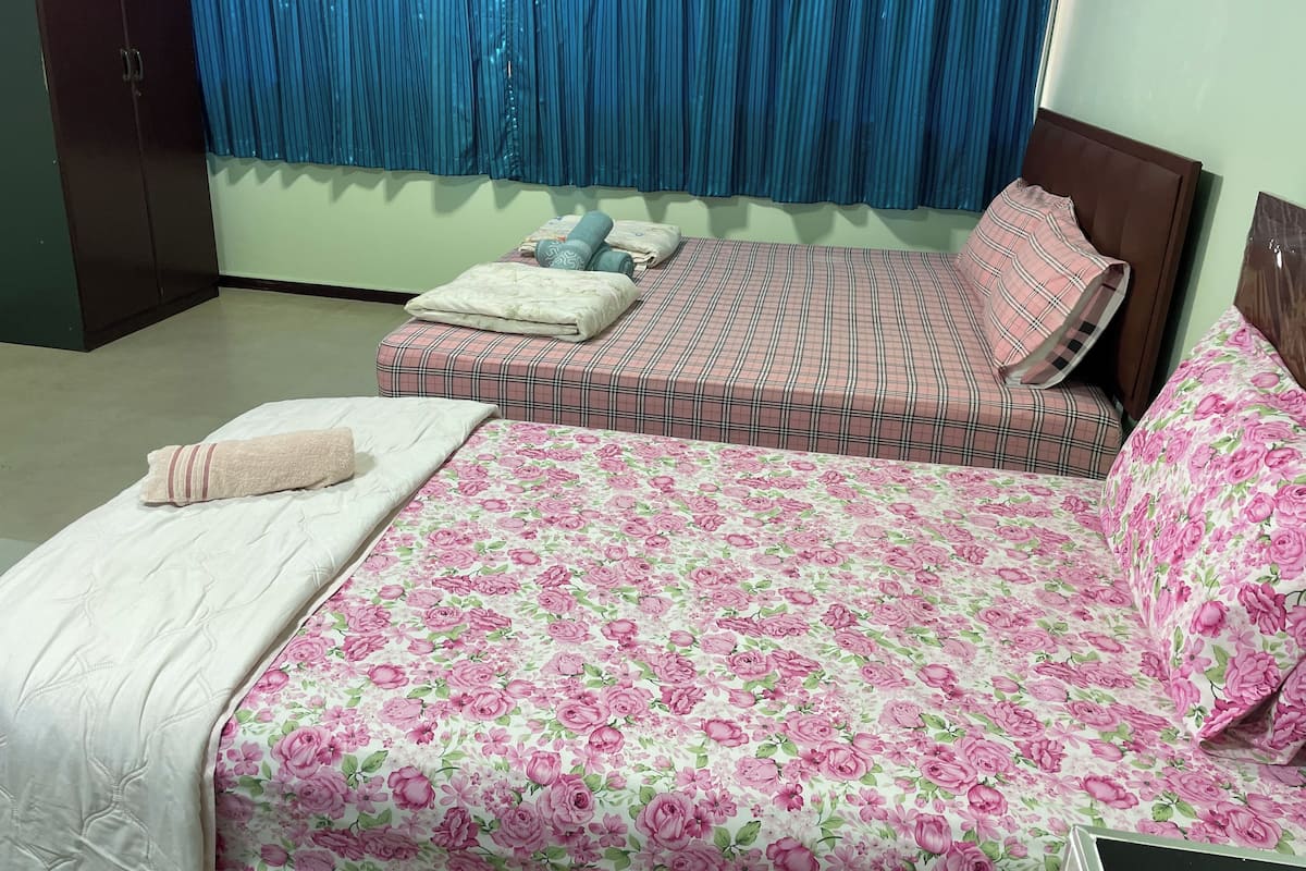 Desk, laptop workspace, blackout drapes, bed sheets