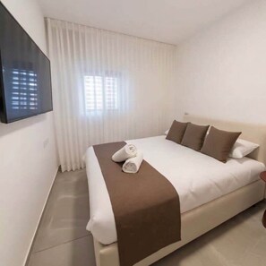 2 habitaciones, tabla de planchar con plancha, wifi y ropa de cama 