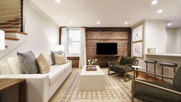 Executive Studio Suite, 1 King Bed, Balcony | Living area | 55-inch Smart TV with cable channels, printers