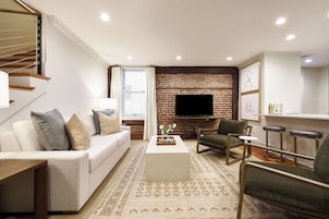 Executive Studio Suite, 1 King Bed, Balcony | Living area | 55-inch Smart TV with cable channels, printers