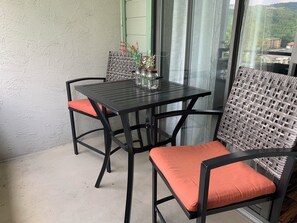 Outdoor dining - Laurel Inn 606 is a spacious 2BR condo with private balcony close to downtown (Gatlinburg)