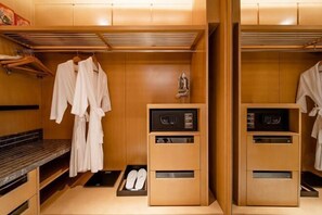 A modern bathroom with a wooden vanity, a towel rack, and a microwave. - Yongkang World Trade International Hotel (Yongkang)