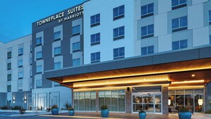 A modern hotel exterior with a sign reading "Towneplace Suites by Marriott". - Towneplace Suites By Marriott Albuquerque Uptown (Albuquerque)