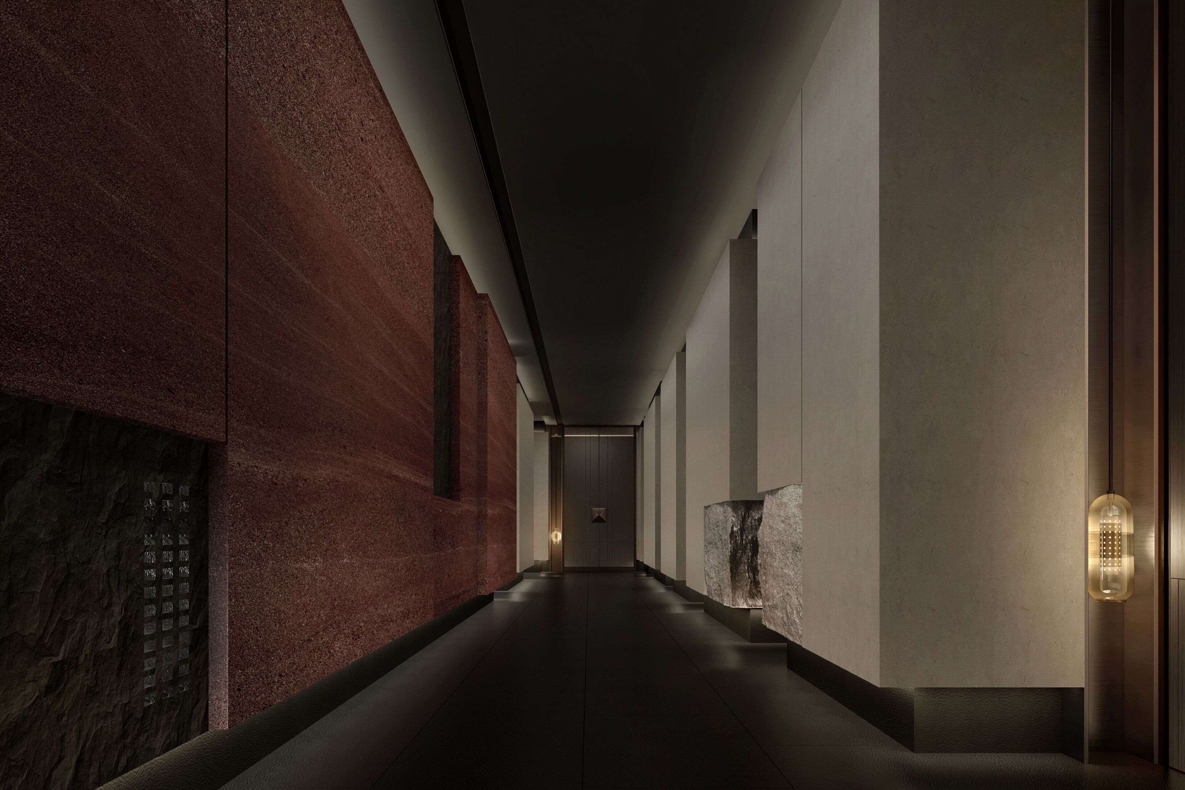 A long, narrow hallway with a dark floor, walls with a reddish-brown texture, and a ceiling with recessed lighting.