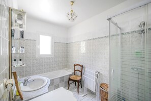 Shower, hair dryer, towels, toilet paper