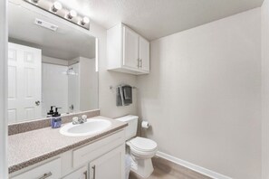 Shower, hair dryer, towels, toilet paper