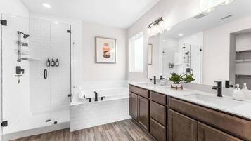 Shower, hair dryer, towels, shampoo