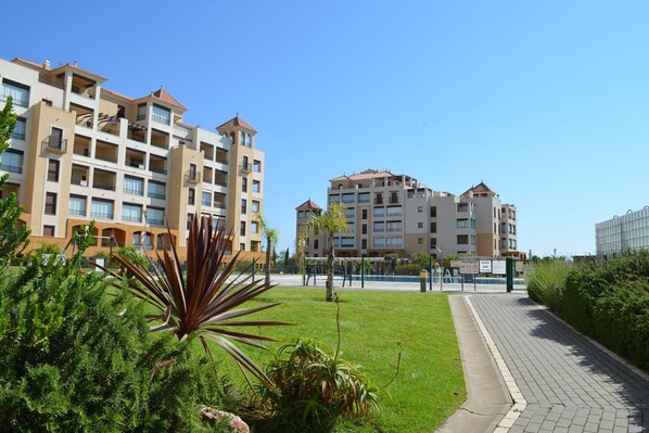 A multi-story residential building with balconies and a central courtyard. - Las Arenas 259 - Two Bedroom Apartment, Sleeps 5 (Punta del moral)