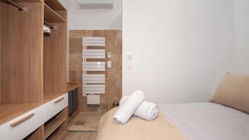 1 bedroom, desk, iron/ironing board, travel crib