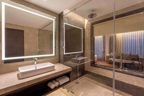 Shower, hair dryer, slippers, soap - Grand Mirage Dhanbad, A Member Of Radisson Individuals (Dhanbad)