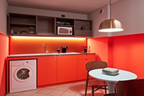 Fridge, microwave, stovetop, coffee/tea maker