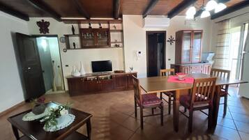 Comfort House, Balcony | Living area | Flat-screen TV
