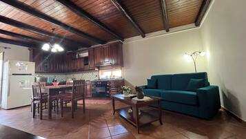 Comfort House, Balcony | Living area | Flat-screen TV