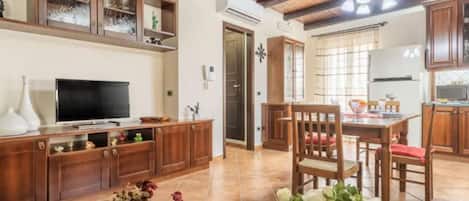 Comfort House, Balcony | Living area | Flat-screen TV